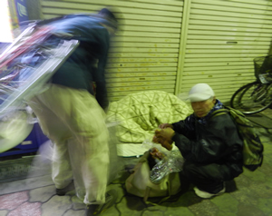 The Batman handing out meals to the homeless in Tennoji Osaka