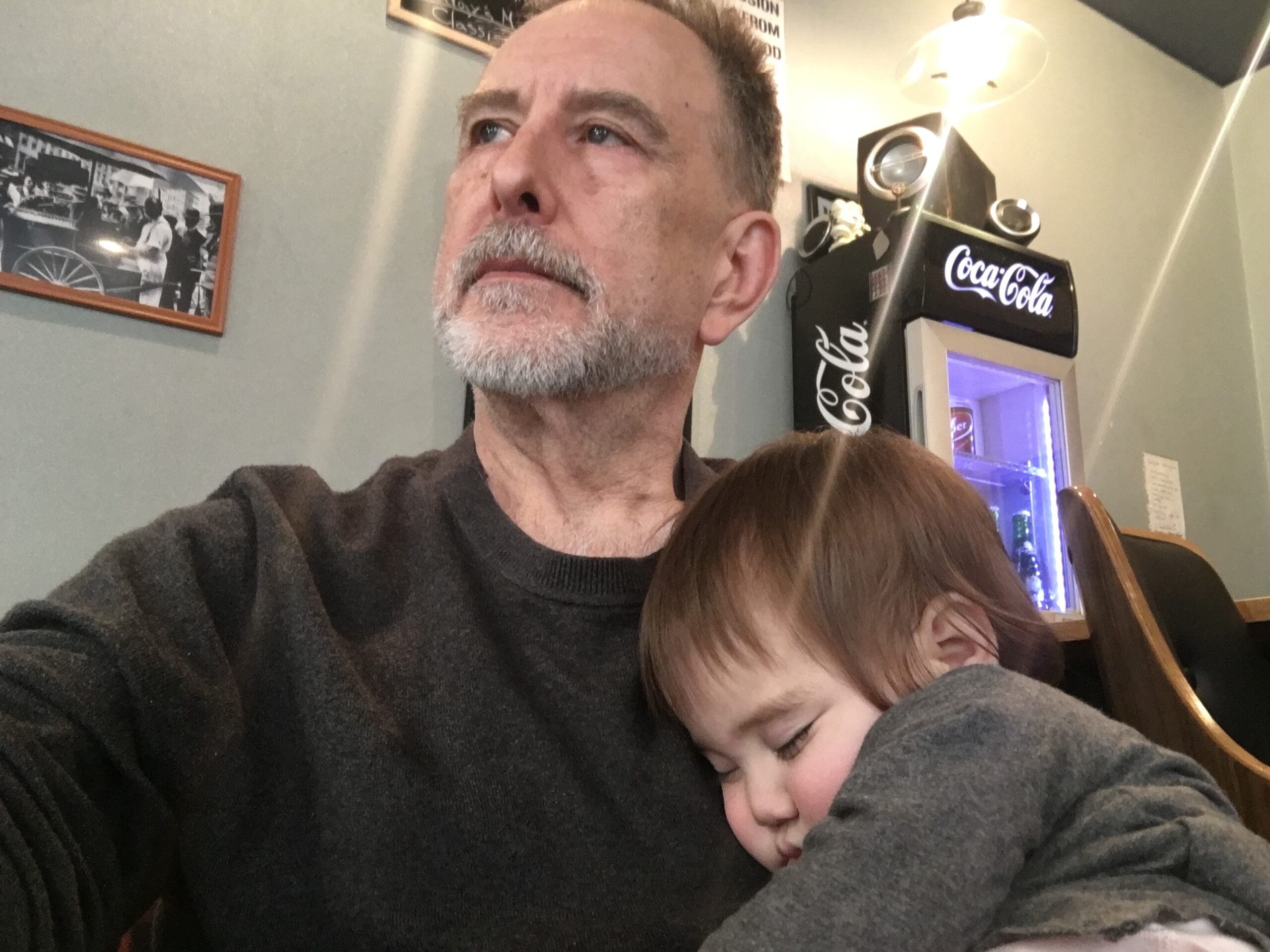 Kozmoz Director Barry Wyatt comforting a child in Kyoto